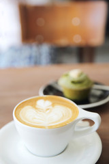 cappuccino coffee on wood background