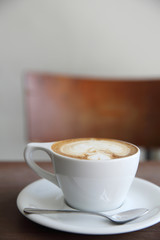cappuccino coffee on wood background