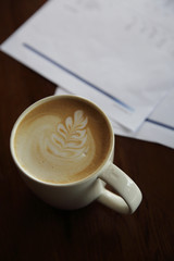 cappuccino coffee on wood background
