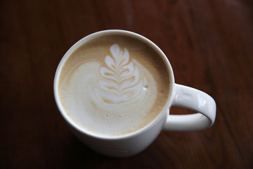 cappuccino coffee on wood background