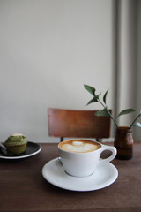 cappuccino coffee on wood background