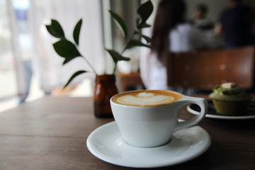 cappuccino coffee on wood background