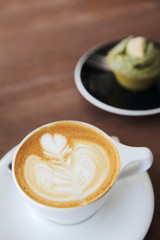 cappuccino coffee on wood background