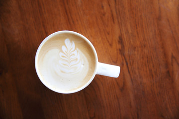 cappuccino coffee on wood background