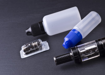 Naklejka premium modern vaporizer boxmod e-cig device on grey background