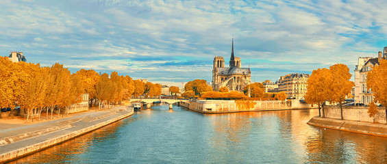 View of Notre Dame de Paris and Seine river in Autumn