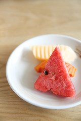 Watermelon melon slice on wood