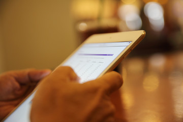 A hand with business tablet