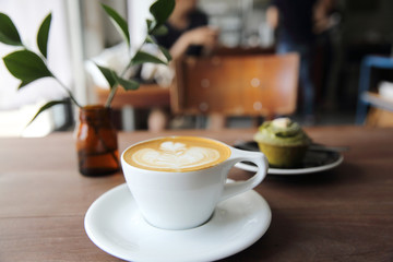 cappuccino coffee on wood background