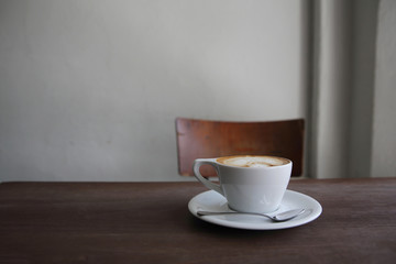 cappuccino coffee on wood background