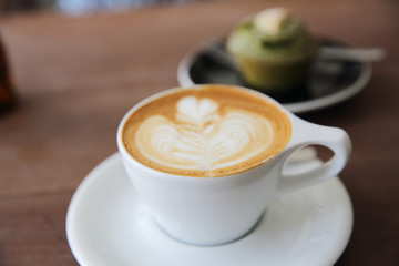 cappuccino coffee on wood background