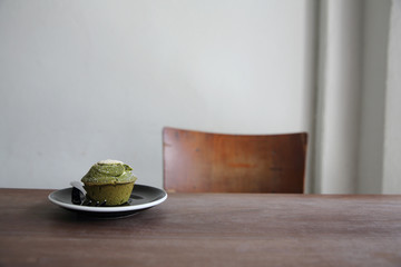 Green tea Muffin on wood