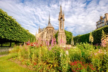 Fotobehang Notre Dame de Paris Cathedral, garden with flowers © tilialucida