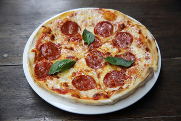 pepperoni pizza on wood