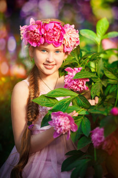  portrait of little girl outdoors with peony