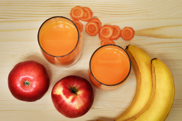 Freshly squeezed carrot juice with apples and bananas