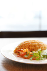 Fried rice with shrimp on wood