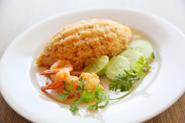 Fried rice with shrimp on wood