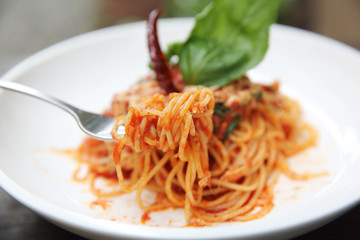 Spaghetti with tomato sauce and fresh basil on wood , Italian pasta