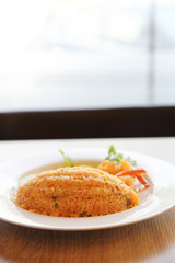 Fried rice with shrimp on wood