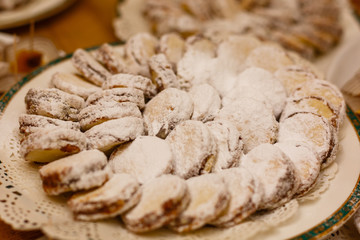 alfajores freshly baked cookies closeup on a plate on the table. horizontal