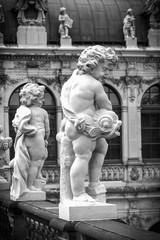Zwinger palace in Dresden, Germany. Sculpture and architecture. Details. Black and white photo