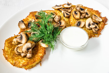 A delicious dish. Cutlets in breading with mushrooms, sauce and dill. Horizontal frame
