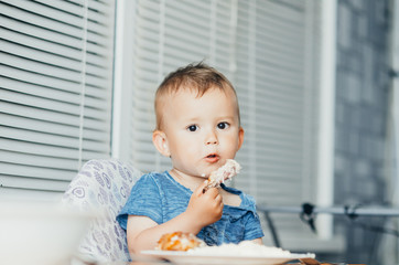 Fototapeta premium The child eats Lunch,meat chicken