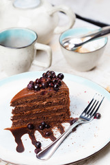 Chocolate-berry cake with currant and tea. Tea with dessert.