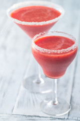 Two glasses of strawberry margarita cocktail