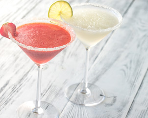 Glasses of lime and strawberry margarita cocktail