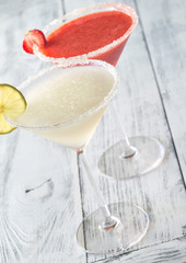 Glasses of lime and strawberry margarita cocktail