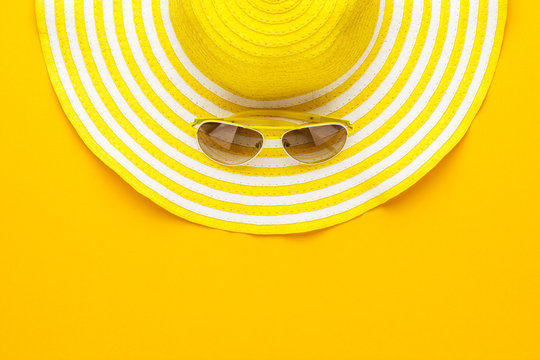 yellow sunglasses and striped retro hat. summer concept