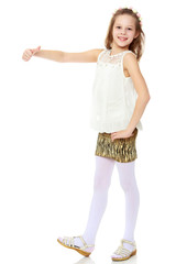 Girl holding up a thumb.