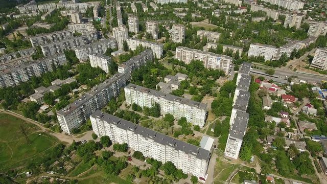Heart breaking view on Kherson city in Ukraine from bird`s eye perspective with multistoreyed apartment blocks, green streets,parks, in a sunny day in spring. The cityscape and skyscape look great