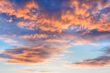 Naklejka na ściany i meble Beautiful dramatic sunset sky with colorful clouds
