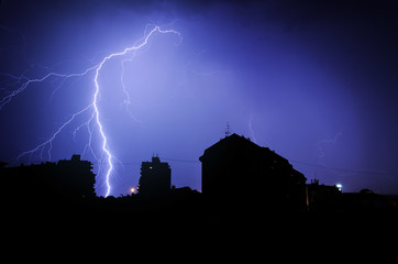 Silhuette of Thunderbolt over the buildings