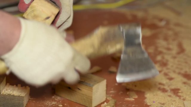 joiner works with an axe, carpenter cleaves pieces of wood