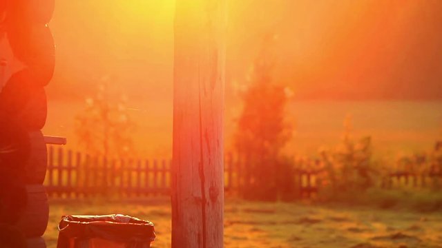 Rural house in village beautiful sundawn. Close up of rustic house beautiful sunlight. Landscape rural house in morning in bright sunlight. Rural nature and wooden village house at sunrise