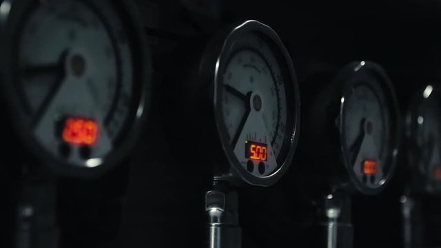 Multiple Gauges Reading Pressure on Equipment