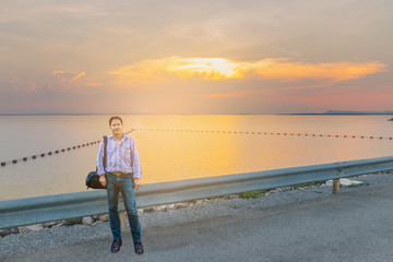Abstract soft blurred and soft focus the silhouette of the sunset with the man, the buoy, the...