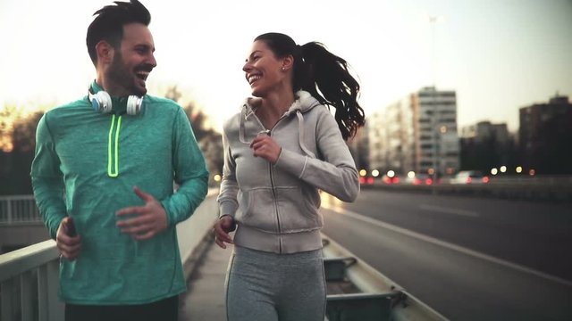 Happy friends and sports people jogging and running outdoor