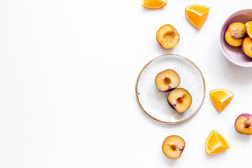 orange and peach summer sweet dessert on plates, white background top view mock-up