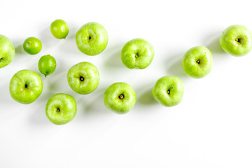 fitness food with green apples on white background top view