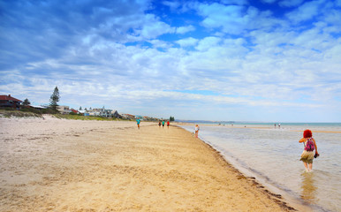People walking along beach