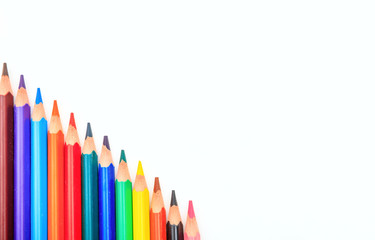 Colored pencils on white background