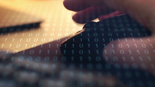 IT Computer Concept - closeup of mouse with binary code overlay