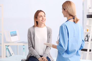 Beautiful young woman at doctor's office