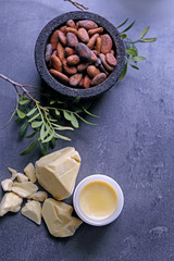 Beautiful composition with cocoa butter lotion on table