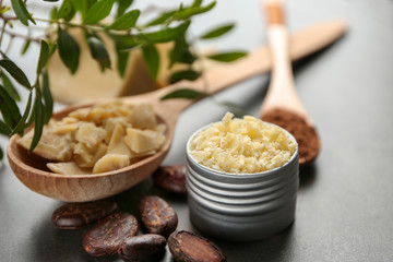 Beautiful composition with cocoa butter product on table